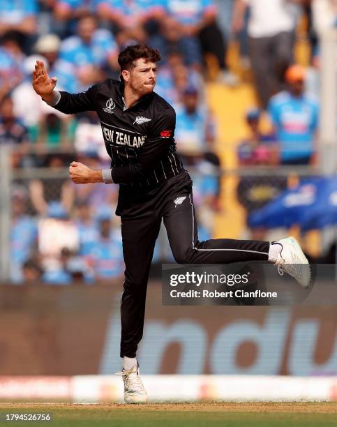 Mitchell Santner of New Zealand bowls during the ICC Men's Cricket World Cup India 2023 Semi Final match between India and New Zealand at Wankhede...