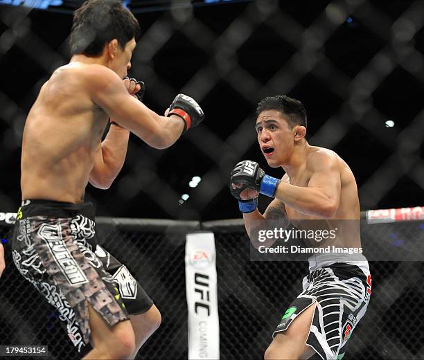 Erik Perez looks for an opening to throw a punch during a bantamweight bout during UFC Fight Night 27 Condit v Kampmann 2 at Bankers Life Field House...