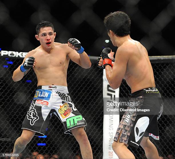 Erik Perez looks for an opening to throw a punch during a bantamweight bout during UFC Fight Night 27 Condit v Kampmann 2 at Bankers Life Field House...