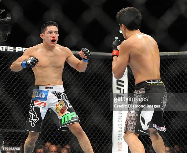 Erik Perez looks for an opening to throw a punch during a bantamweight bout during UFC Fight Night 27 Condit v Kampmann 2 at Bankers Life Field House...