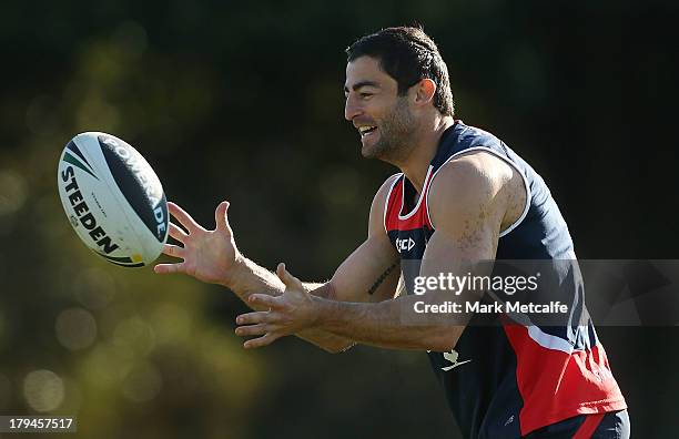 Anthony Minichiello performs a passing drill during a Sydney Roosters NRL training session at Moore Park on September 4, 2013 in Sydney, Australia.