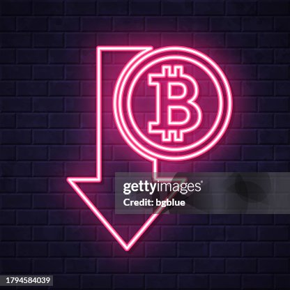 Bitcoin decrease. Glowing neon icon on brick wall background Bitcoin decrease. Glowing neon icon on brick wall background