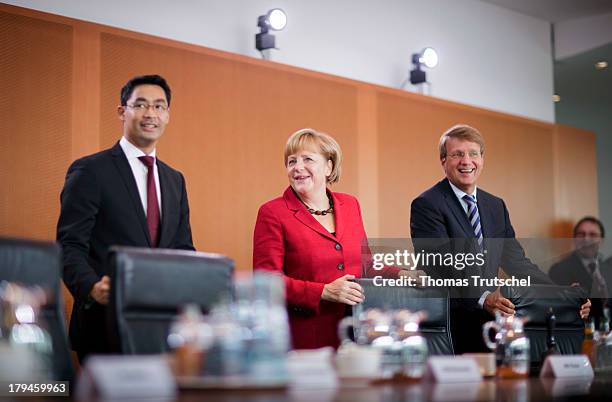 German Economy Minister and Vice Chancellor Philipp Roesler, German Chancellor Angela Merkel, and Head of the German Chancellery Ronald Pofalla,...