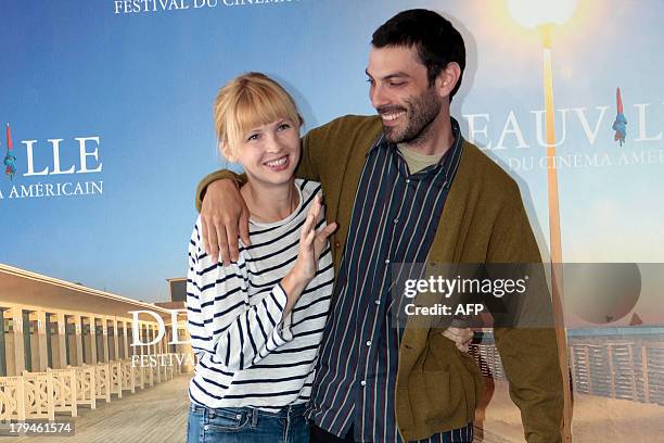 Director Matt Creed and US actress Amy Grantham pose during a photocall to present "Lily", his latest movie on September 4, 2013 as part of the...