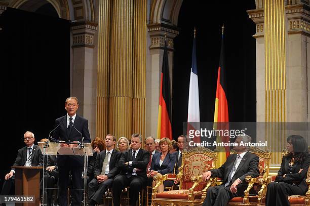 Mayor of Paris Bertrand Delanoe speaks during a reception with German President Joachim Gauck and French deputy minister responsible for French...