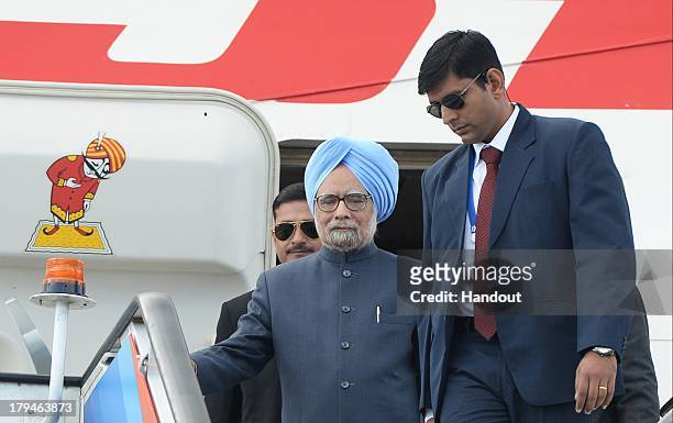 In this handout image provided by Ria Novosti, Indian Prime Minister Manmohan Singh arrives ahead of the G20 summit on September 4, 2013 in St....