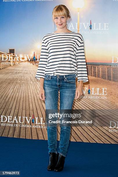 Amy Grantham poses at a photocall for the film 'Lily' during the 39th Deauville Film Festival on September 4, 2013 in Deauville, France.