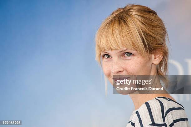 Amy Grantham poses at a photocall for the film 'Lily' during the 39th Deauville Film Festival on September 4, 2013 in Deauville, France.