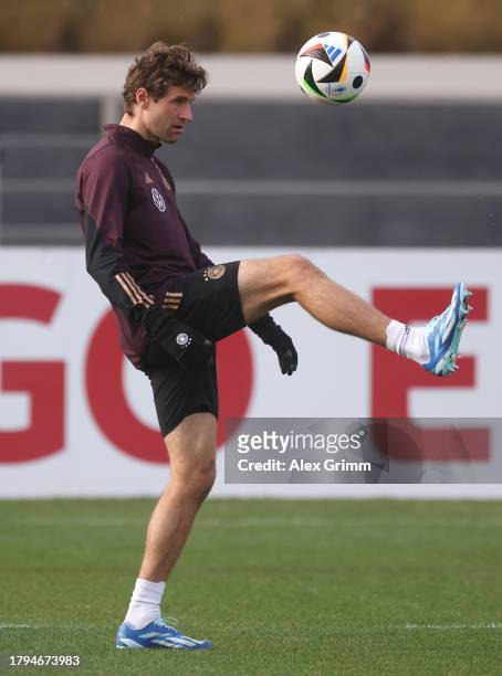 Thomas Mueller juggles with the ball during a training session of the German national football team at DFB-Campus on November 15, 2023 in Frankfurt...