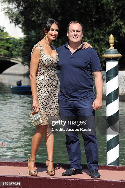 Actress Maria Grazia Cucinotta and Giulio Violati are seen during the 70th Venice International Film Festival on September 4, 2013 in Venice, Italy.