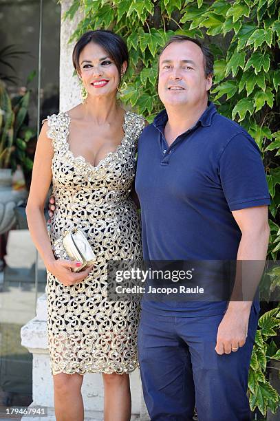 Actress Maria Grazia Cucinotta and Giulio Violati are seen during the 70th Venice International Film Festival on September 4, 2013 in Venice, Italy.