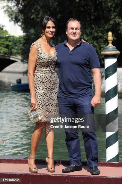 Actress Maria Grazia Cucinotta and husband Giulio Violati are seen during the 70th Venice International Film Festival on September 4, 2013 in Venice,...