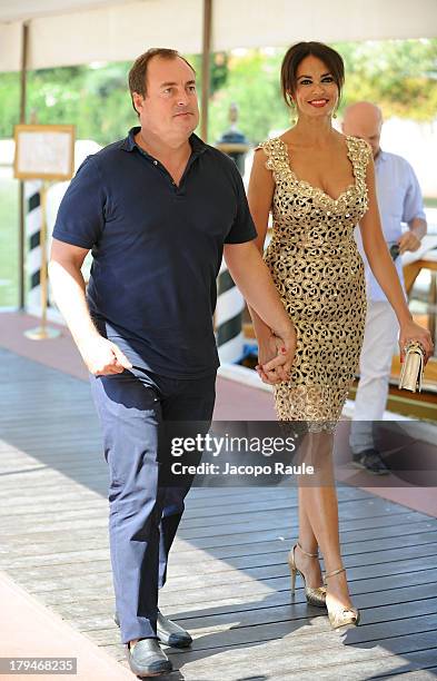 Actress Maria Grazia Cucinotta and husband Giulio Violati are seen during the 70th Venice International Film Festival on September 4, 2013 in Venice,...