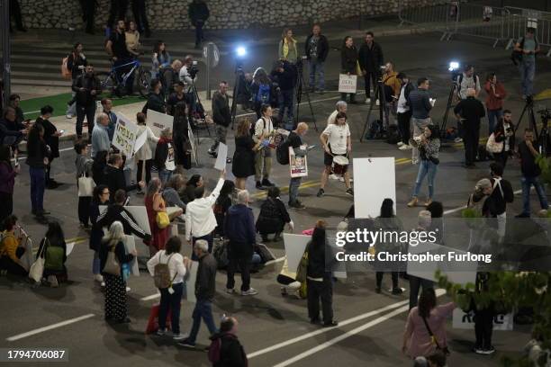 People demonstrate prior any hostage announcements outside the Kirya defense complex as the political cabinet hold a meeting on November 21, 2023 in...