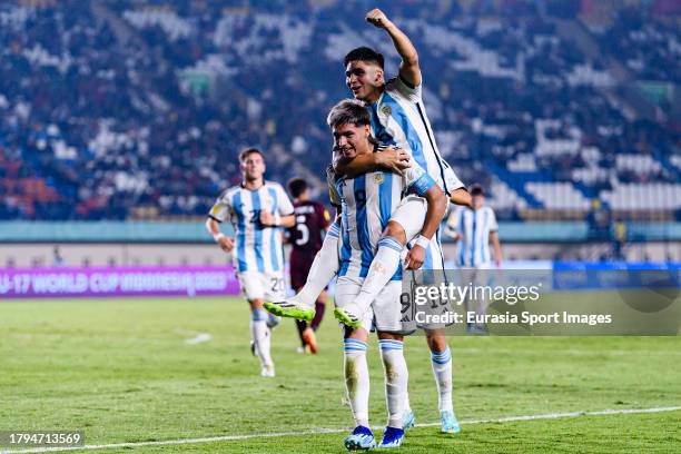 Agustin Ruberto of Argentina celebrates his second goal with his teammate Juan Villalba during FIFA U-17 World Cup Round of 16 match between...