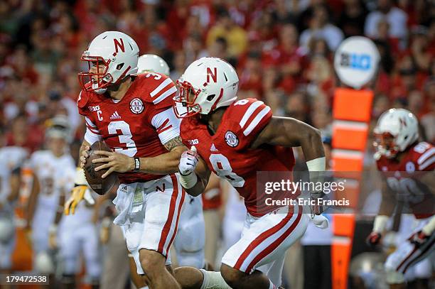 Quarterback Taylor Martinez of the Nebraska Cornhuskers runs down field during their game against the Wyoming Cowboys at Memorial Stadium on August...