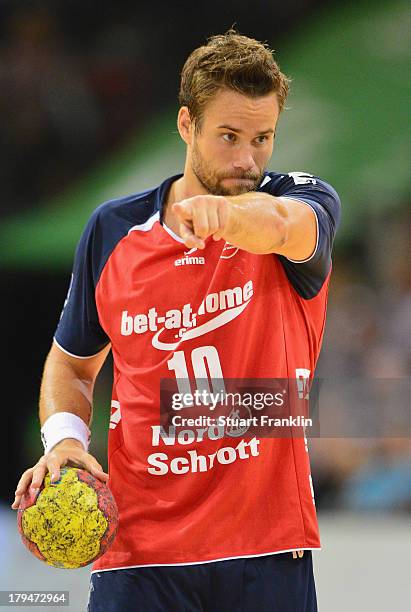 Thomas Mogensen of Flensburg in action during the DKB Bundesliga handball match between Flensburg Handewitt and TSV Hannover-Burgdorf at the Flens...