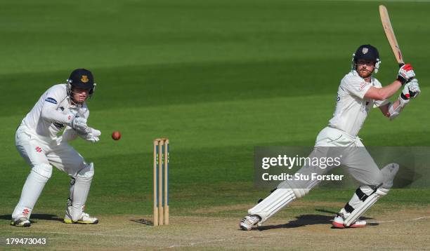 Durham batsman Paul Collingwood picks up some runs watched by Ben Brown during day two of the LV County Championship Division One match between...