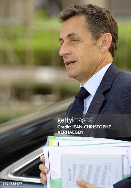 French President Nicolas Sarkozy arrives for the second day of an EU summit at the European Council headquarters on June 19, 2009 in...