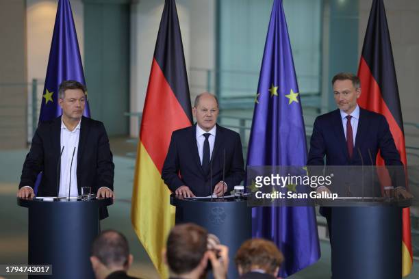German Chancellor Olaf Scholz , Finance Minister Christian Lindner and Economy Minister Robert Habeck give statements to the media following the...