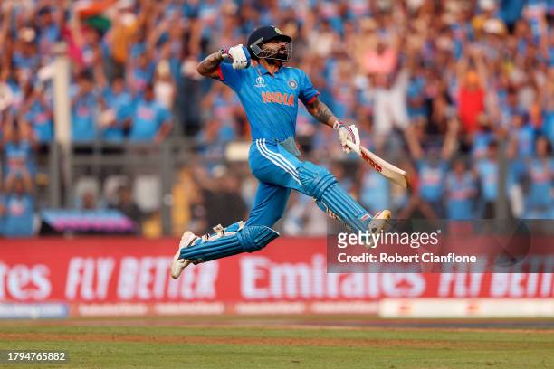 Virat Kohli of India celebrates after scoring a century, overtaking Sachin Tendulkar for the all time most ODI centuries during the ICC Men's Cricket...
