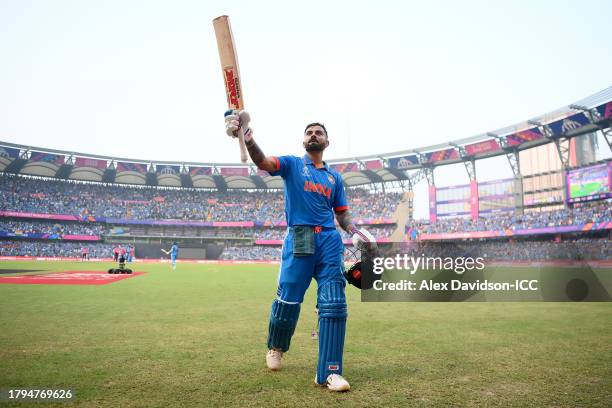 Virat Kohli of India acknowledges the fans while leaving the field after being dismissed by Tim Southee of New Zealand after scoring a century during...