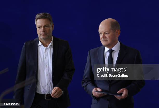 German Chancellor Olaf Scholz and Economy Minister Robert Habeck arrive to give statements to the media following the weekly government cabinet...