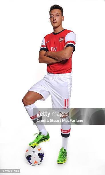 Mesut Ozil poses after signing for Arsenal FC on September 4, 2013 in Munich, Germany.