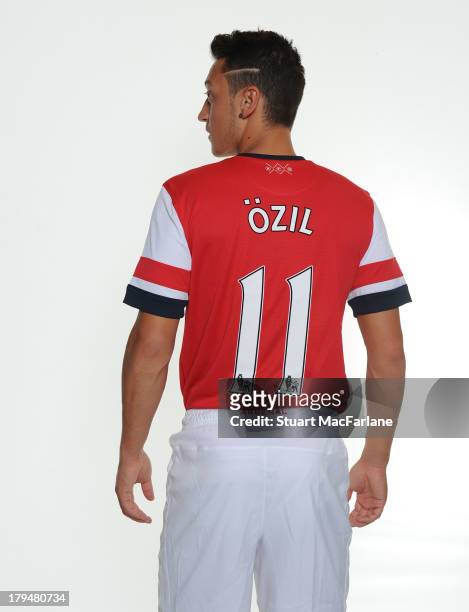Mesut Ozil poses after signing for Arsenal FC on September 4, 2013 in Munich, Germany.