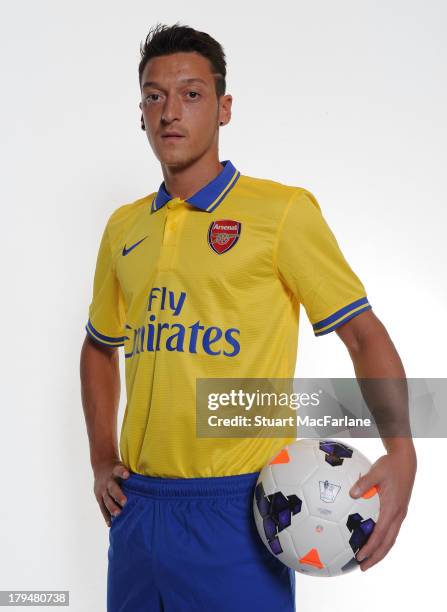 Mesut Ozil poses after signing for Arsenal FC on September 4, 2013 in Munich, Germany.