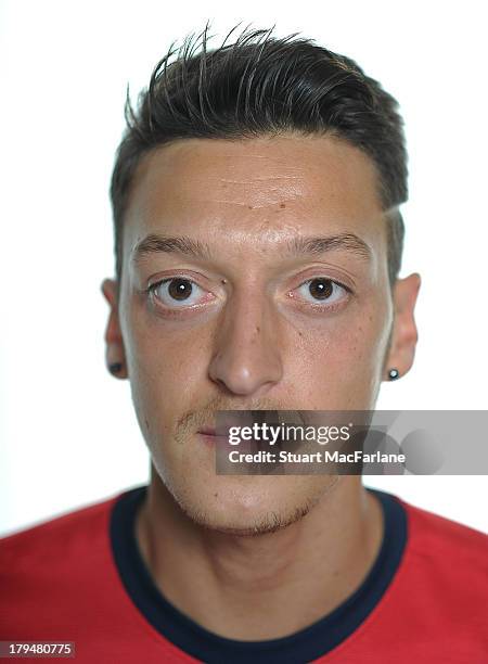 Mesut Ozil poses after signing for Arsenal FC on September 4, 2013 in Munich, Germany.