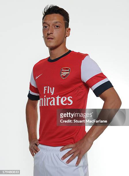 Mesut Ozil poses after signing for Arsenal FC on September 4, 2013 in Munich, Germany.