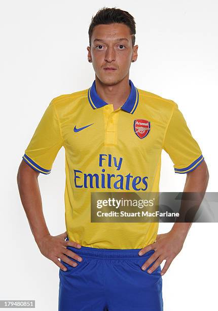 Mesut Ozil poses after signing for Arsenal FC on September 4, 2013 in Munich, Germany.