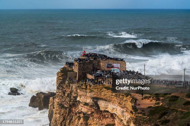 Hundreds of spectators are gathering at the Nazare lighthouse in Nazare, Portugal, on November 5 to take advantage of the forecasted giant waves....