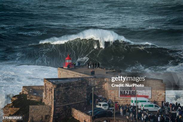 Hundreds of spectators are gathering at the Nazare lighthouse in Nazare, Portugal, on November 5 to take advantage of the forecasted giant waves....