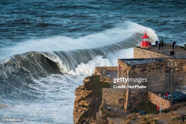 Hundreds of spectators are gathering at the Nazare lighthouse in Nazare, Portugal, on November 5 to take advantage of the forecasted giant waves....