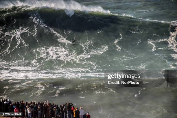 Hundreds of spectators are gathering at the Nazare lighthouse in Nazare, Portugal, on November 5 to take advantage of the forecasted giant waves....