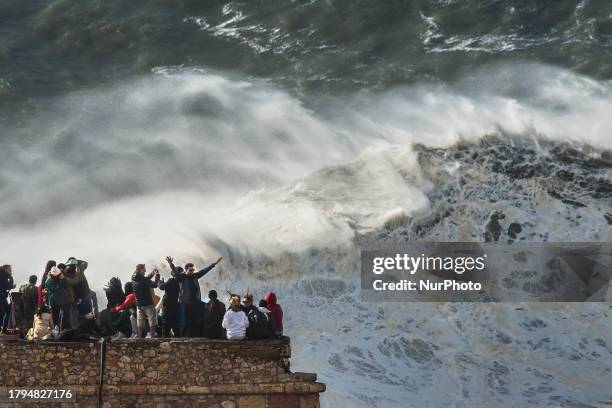 Hundreds of spectators are gathering at the Nazare lighthouse in Nazare, Portugal, on November 5 to take advantage of the forecasted giant waves....