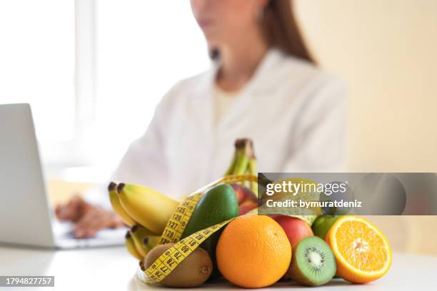 nutritionist female doctor in her office - immune system stock pictures, royalty-free photos & images