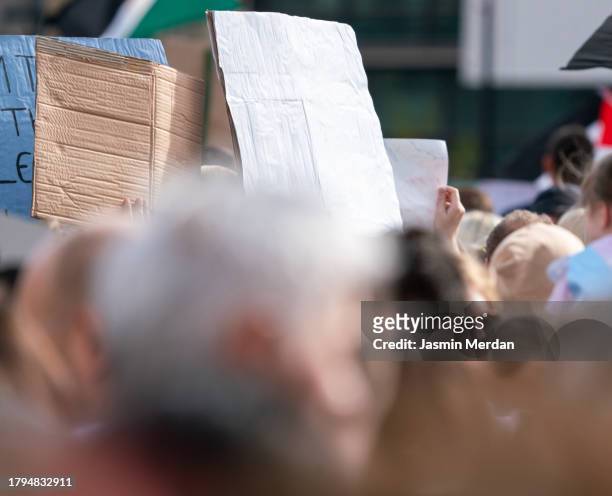 people in crowd holding copy space cardboard - brand advocacy stock pictures, royalty-free photos & images