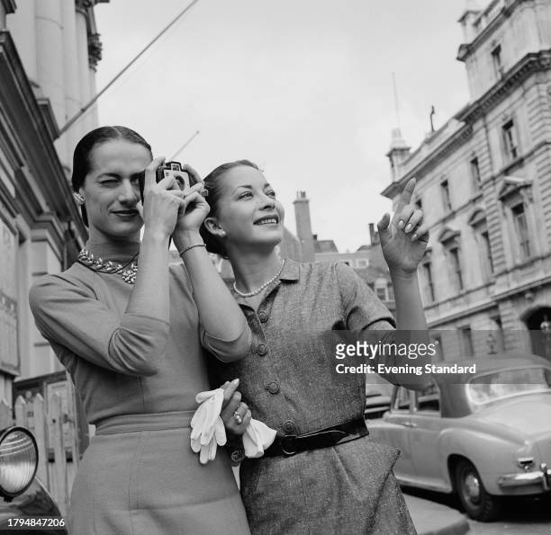 American ballet dancers Lupe Serrano , left, and Ruth Ann Koesun taking photos and sightseeing in Britain, August 28th 1956.