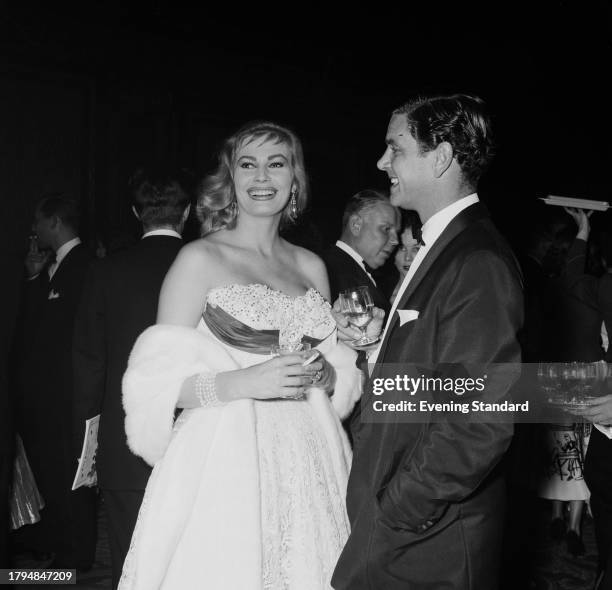 Model and actress Anita Ekberg with her husband, Anthony Steel at a social event, September 24th 1956.