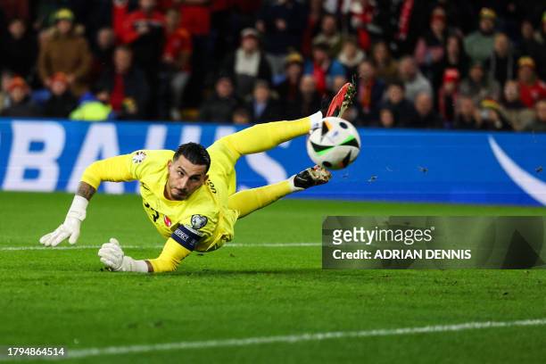 Wales' defender Neco Williams shoots past Turkey's goalkeeper Ugurcan Cakir and scores his team first goal during the UEFA Euro 2024 Group D...