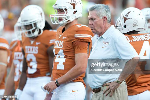 Head coach Mack Brown of the Texas Longhorns stands next to quarterback David Ash before kickoff against the New Mexico State Aggies on August 31,...