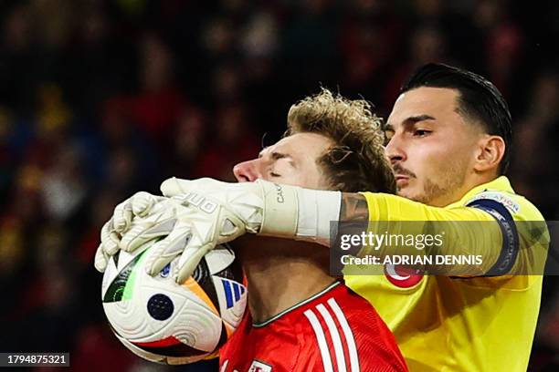 Turkey's goalkeeper Ugurcan Cakir catches the ball during the UEFA Euro 2024 Group D qualifying football match between Wales and Turkey, at Cardiff...