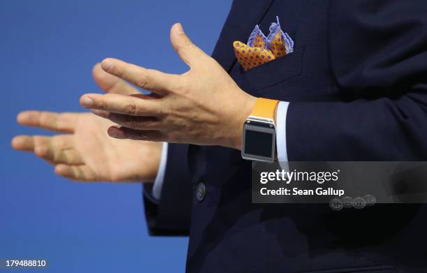Shin, President and CEO of IT and Mobile Communications Division at Samsung, presents the new Samsung Galaxy Gear smart watch at the Samsung Unpacked...