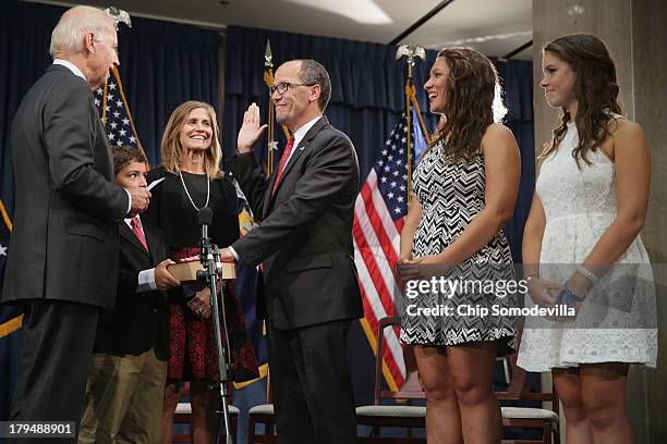 Vice President Joe Biden conducts a ceremonial swearing-in for Labor Secretary Thomas Perez with his wife Ann Marie Staudenmaier and children Rafael...