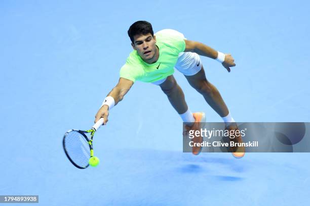Carlos Alcaraz of Spain misses a forehand against Andrey Rublev during the Men's Singles Round Robin match on day four of the Nitto ATP Finals at...