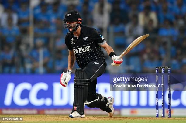 Daryl Mitchell of New Zealand reacts after playing a shot during the ICC Men's Cricket World Cup India 2023 Semi Final match between India and New...