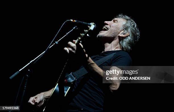 British musician and founding member of Pink Floyd, Roger Waters performs on stage during his "The Wall" show at the Olympic stadium in Berlin on...